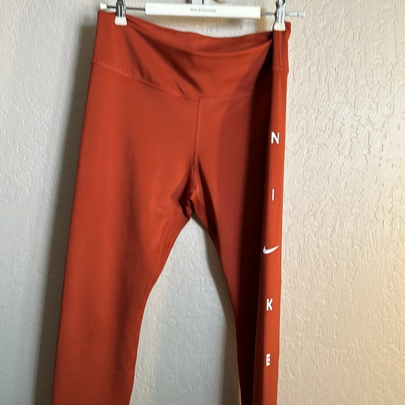 Nike leggings with side logo on the side leg size large NWOT. Burt/brick  color - Picture 2 of 5